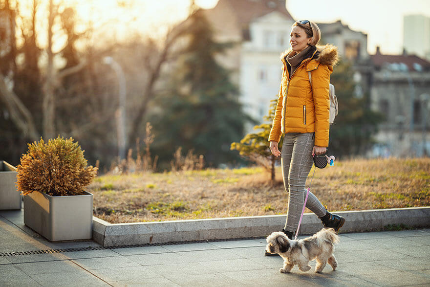 Women-walking-with-her-dog